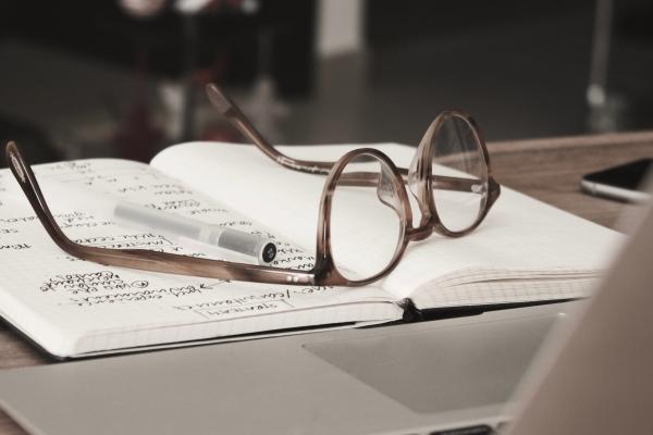 Image of glasses on a notebook