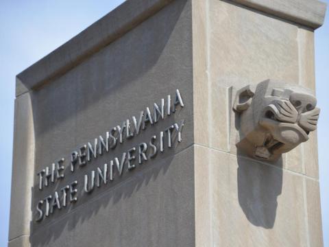 The Pennsylvania State University on the side of a marble tower